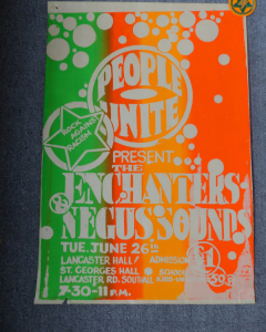 A bright orange and green music poster saying 'people unite present the Enchanters'