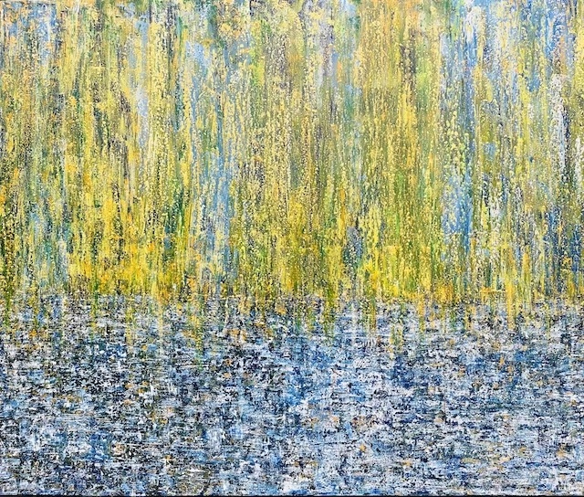 an abstract painting, green and yellow on the top half and blue on the bottom